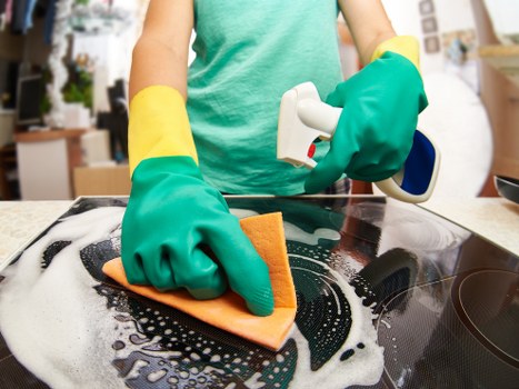 Cleaning moss and algae from an outdoor patio surface